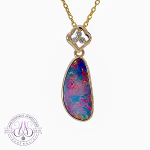 14kt Yellow Gold pendant with one Red Opal doublet and diamonds