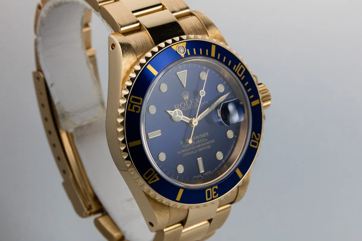 1999 Rolex 18K YG Submariner Blue Dial with Box and Papers