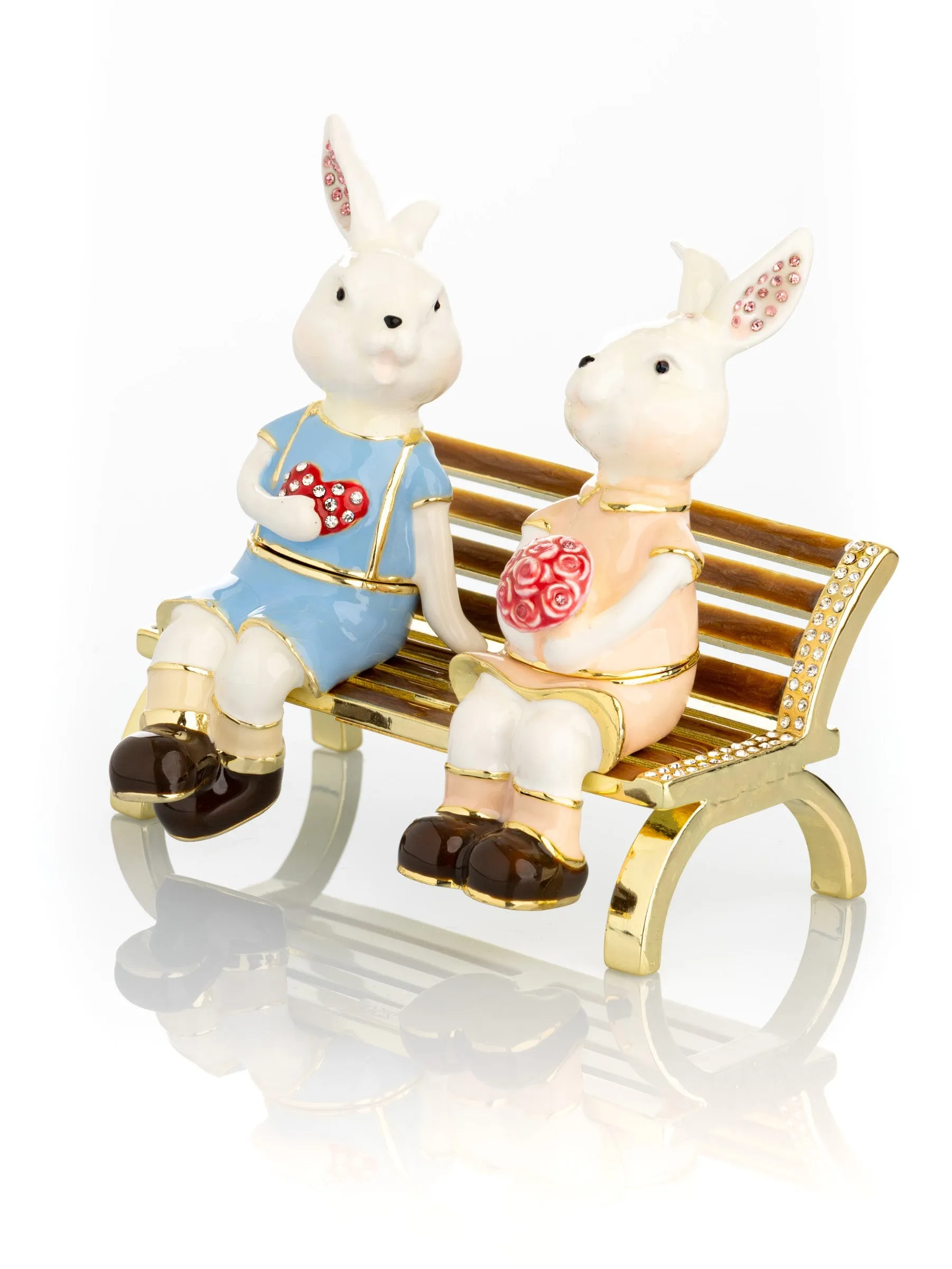 2 bunnies in love sitting on a bench, valentine flowers and chocolates