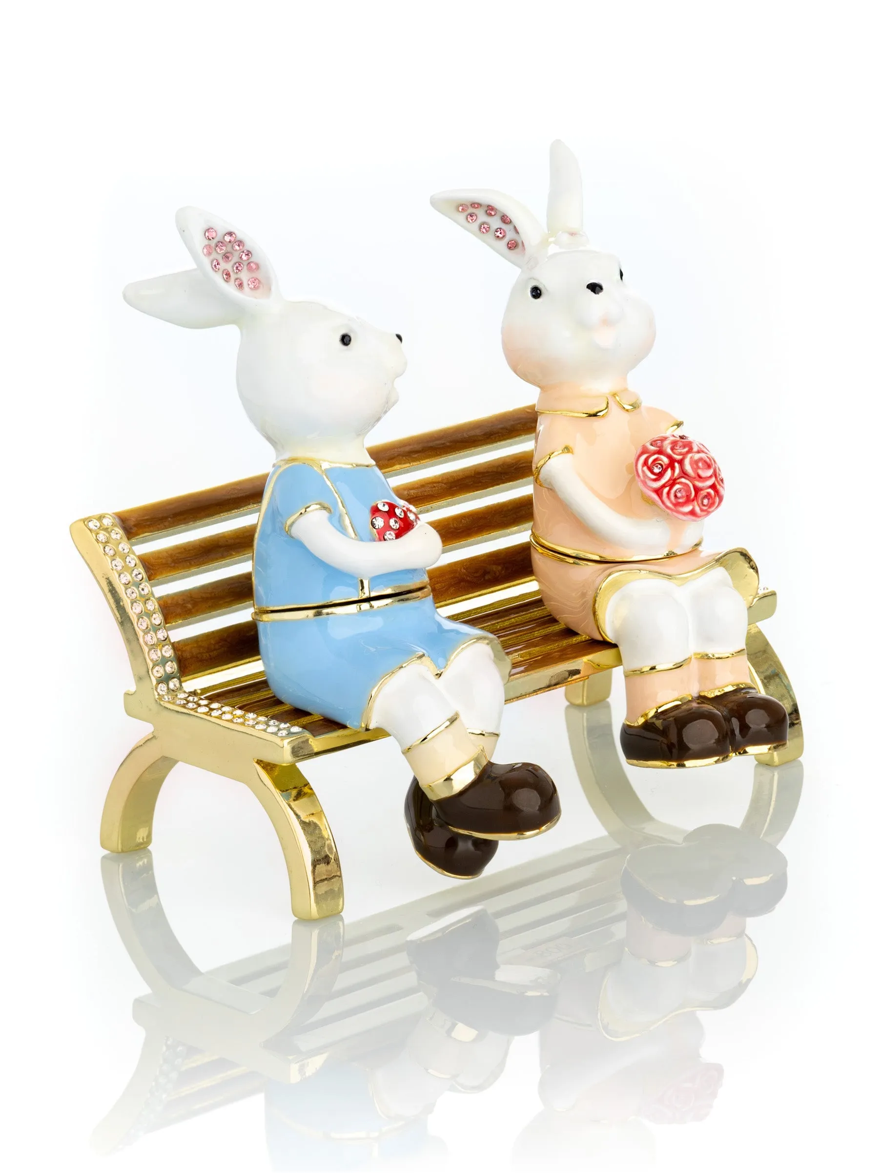 2 bunnies in love sitting on a bench, valentine flowers and chocolates