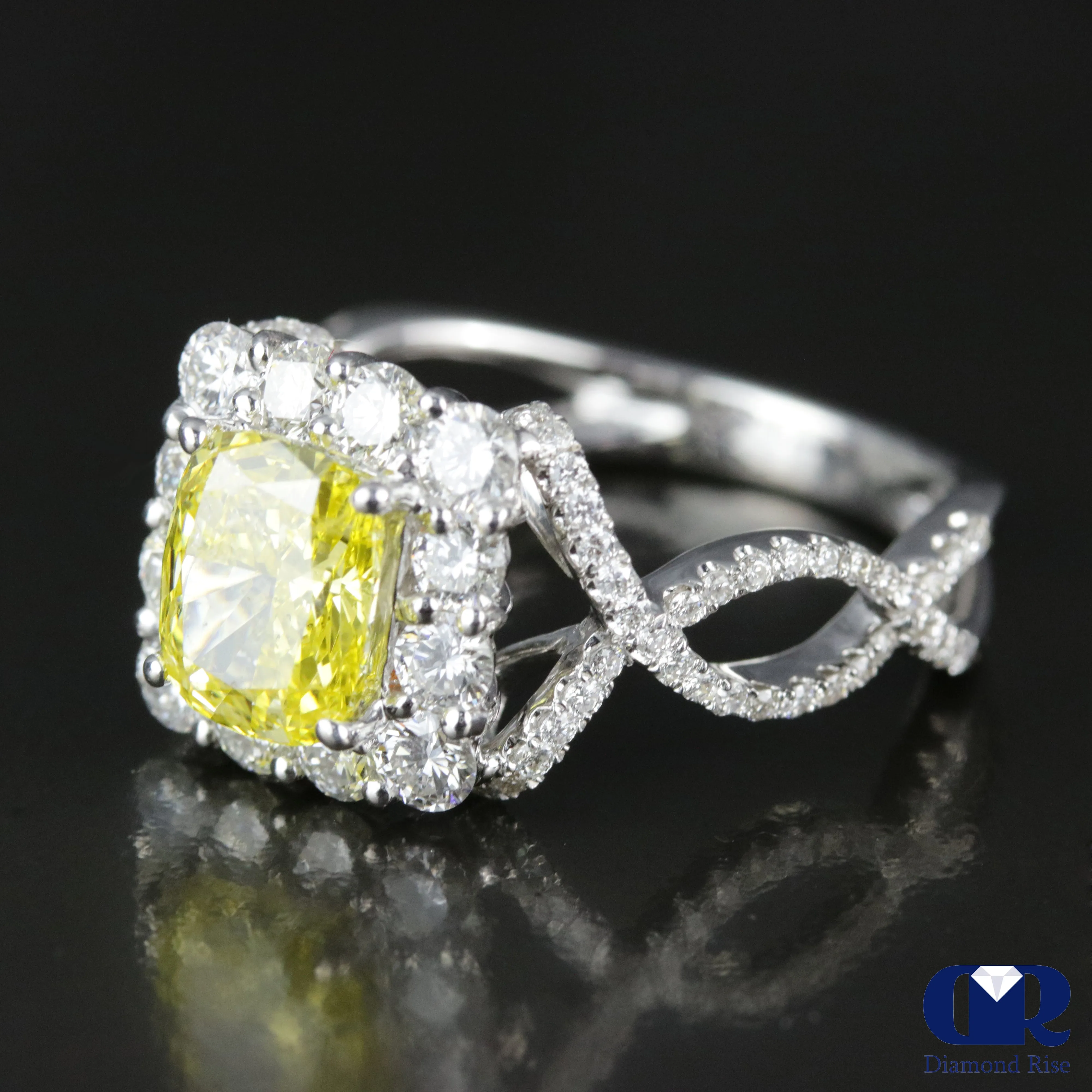 2.45 Carat Fancy Yellow Cushion Cut Diamond Twisted Engagement Ring In 18K White Gold