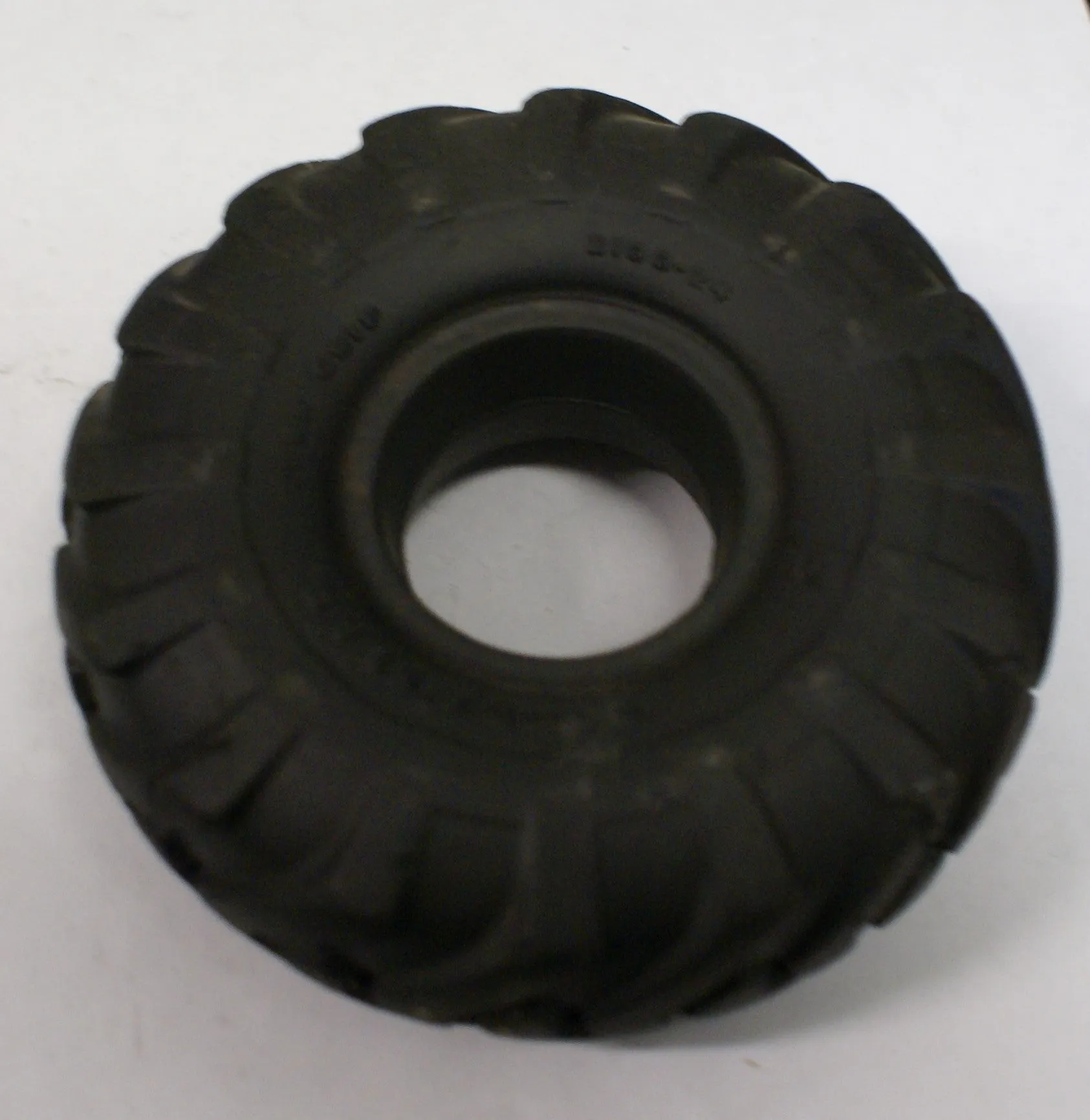 4-1/2' x 1-1/2" hard rubber toy tire. Original.