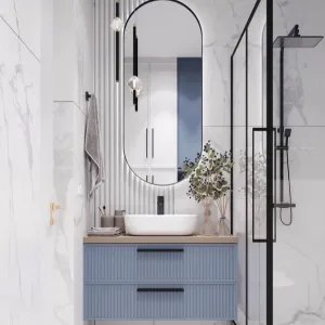 A Modern Floating Bathroom Vanity with Ribbed Blue Cabinetry, Neutral Countertop, and Elegant Vessel Sink Design