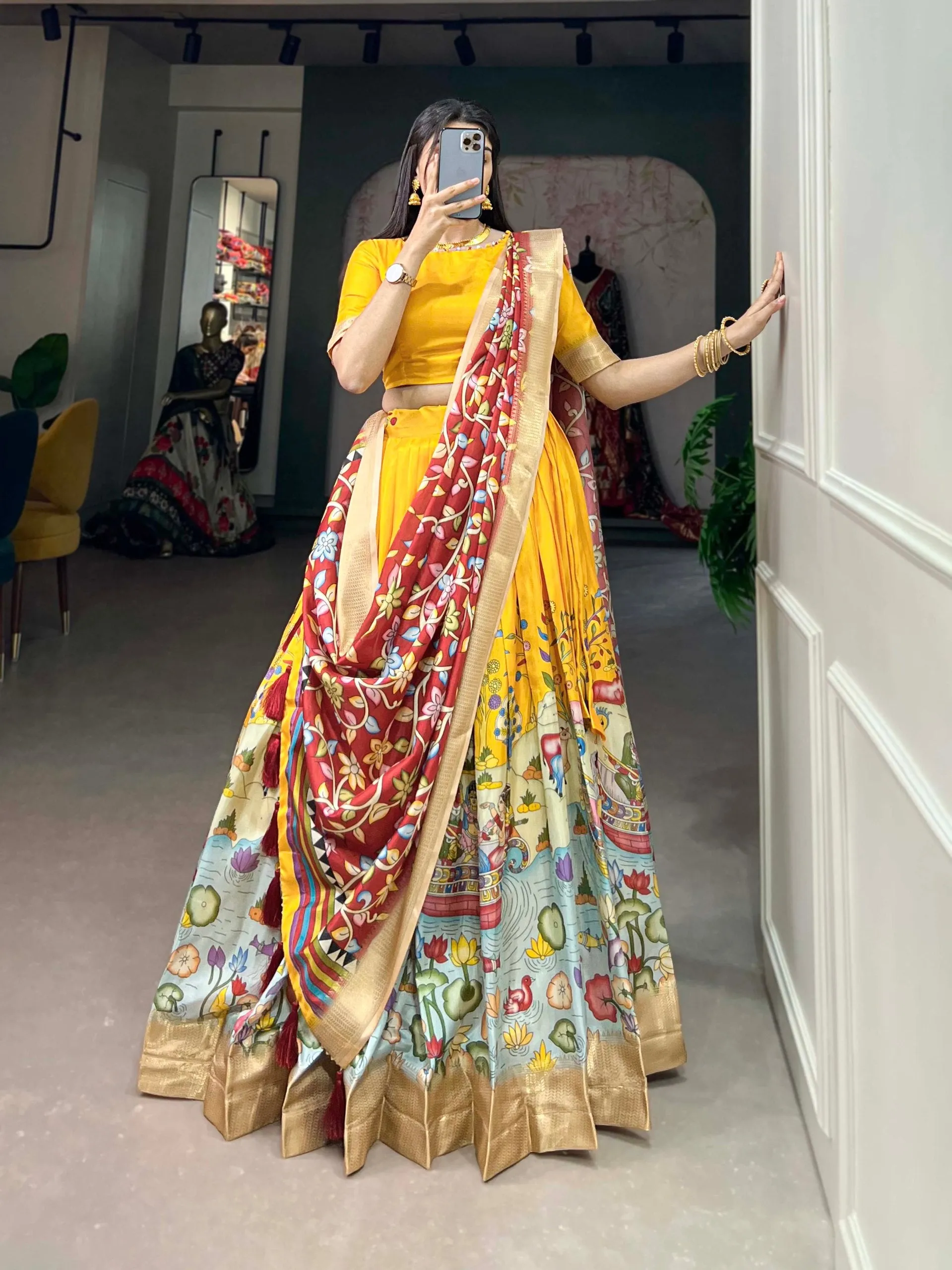 Alluring Yellow Dola Silk Lehenga Choli with Enchanting Kalamkari Prints