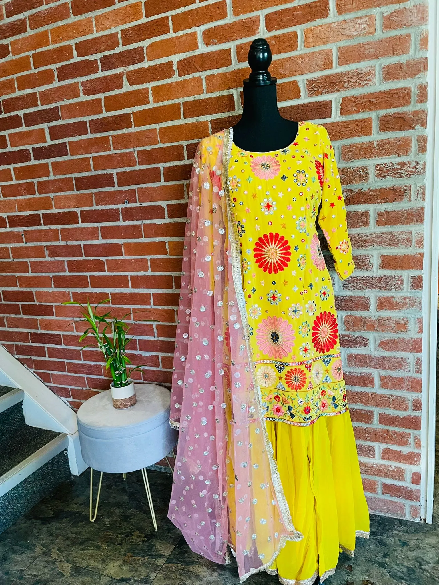 AMI109 - Party Wear Sharara Set in Yellow with Heavy Embroidery work. Comes with Pink Dupatta