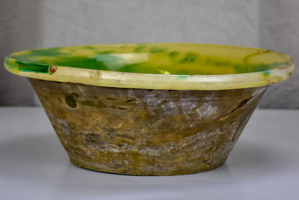 Antique Spanish bowl with yellow and green glaze