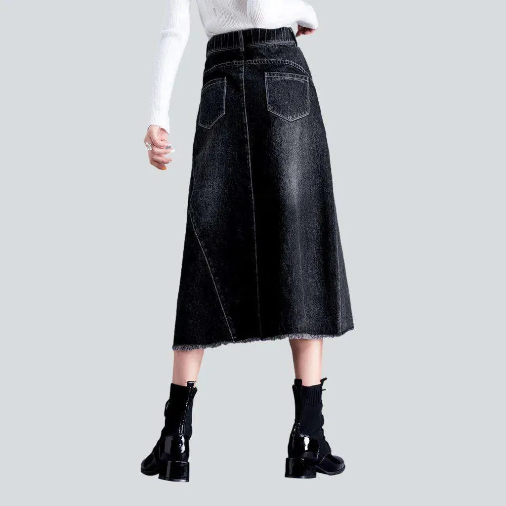 Asymmetric hem whiskered denim skirt