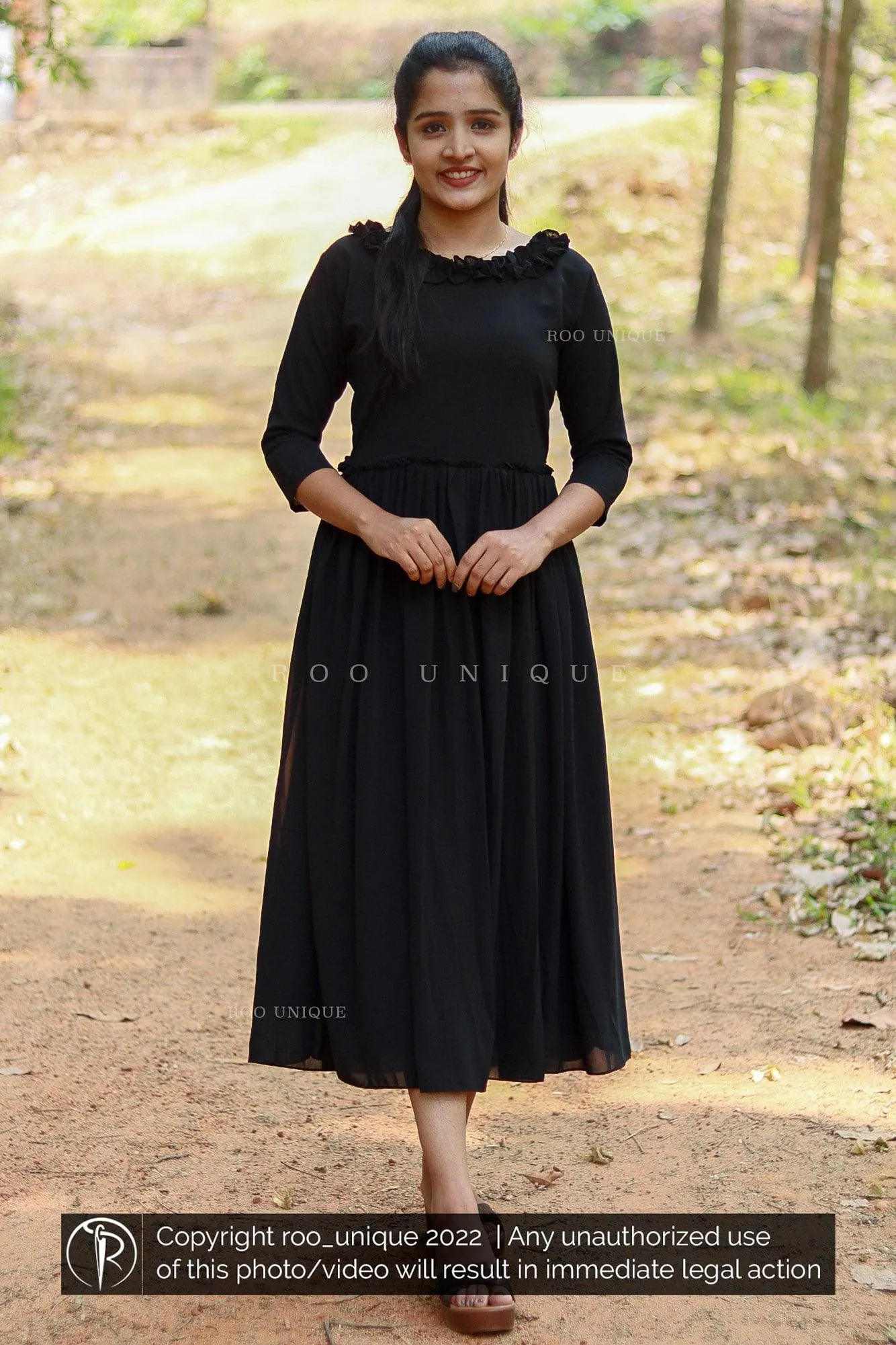 Black Dress With Frilled Neck And Waist Gathering