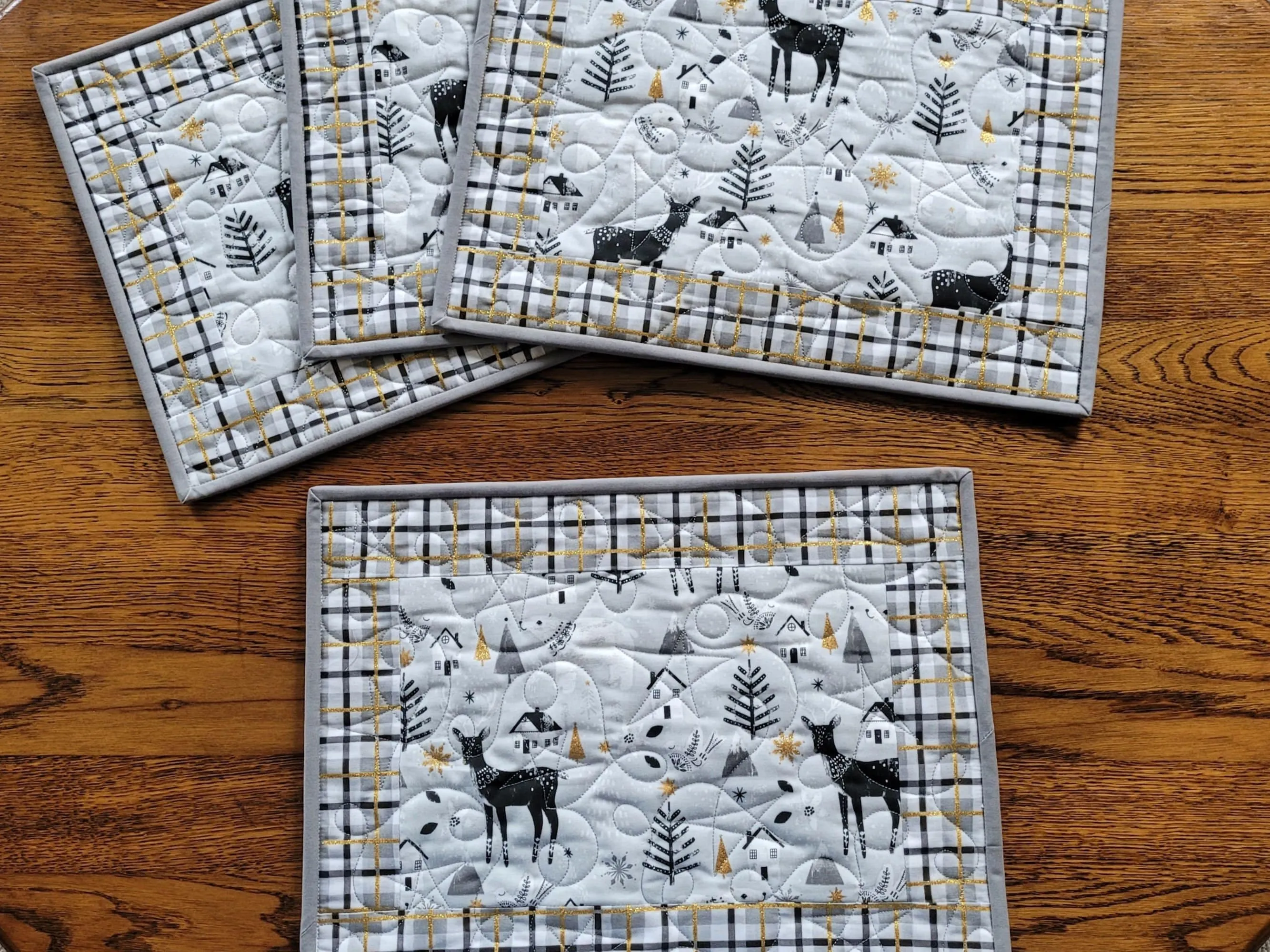 Christmas Placemats | Quilted Plaid Table Mats with Reindeer, Winter Trees and Gold Metallic Accents