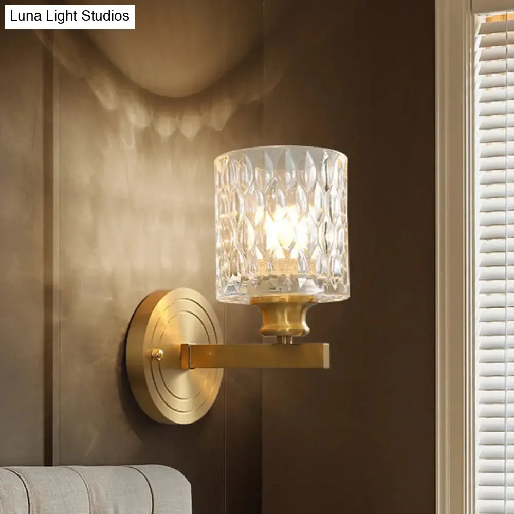 Contemporary Cylindrical Wall Light: Stylish Clear Dimpled Glass Design, Golden Wall Sconce for Bedroom