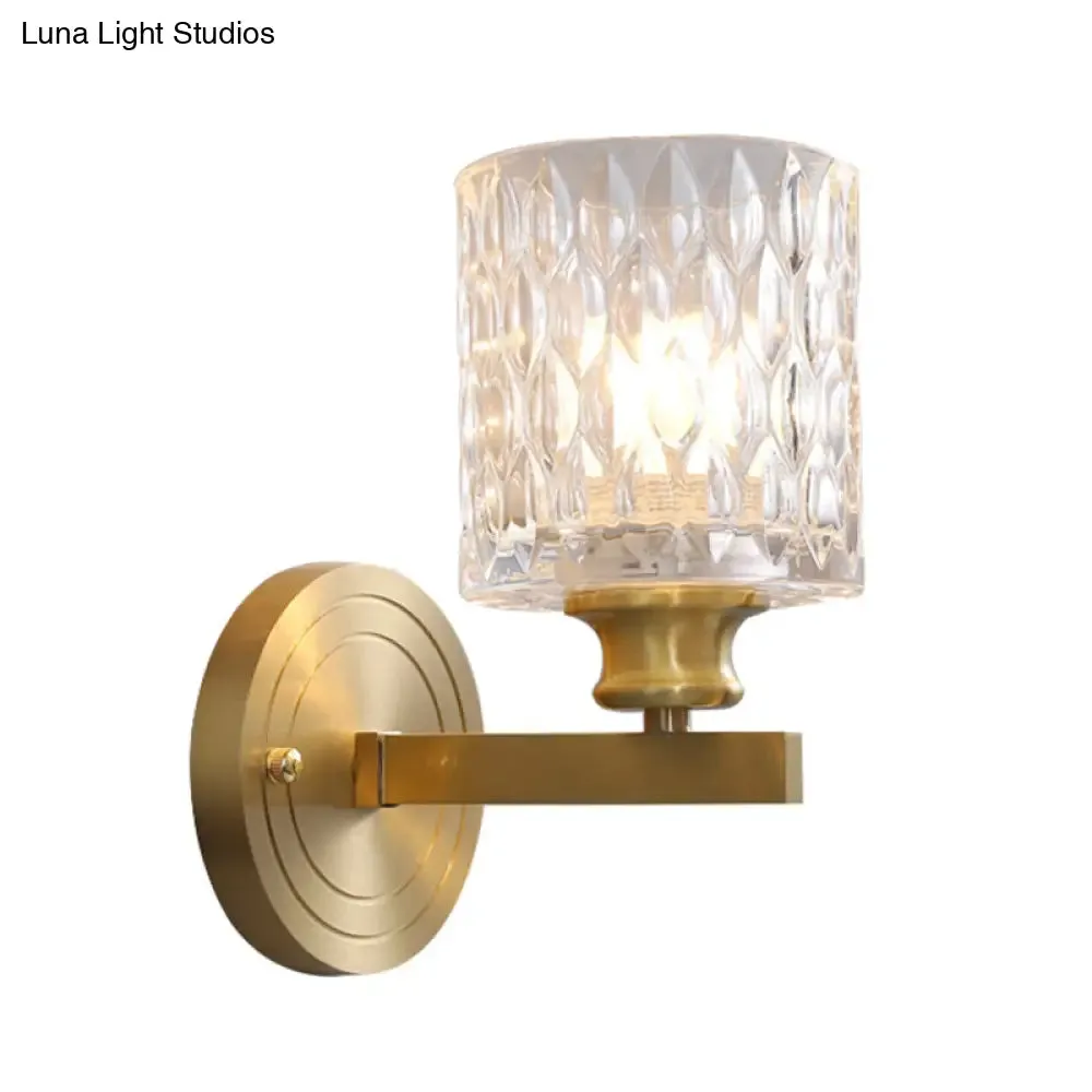 Contemporary Cylindrical Wall Light: Stylish Clear Dimpled Glass Design, Golden Wall Sconce for Bedroom