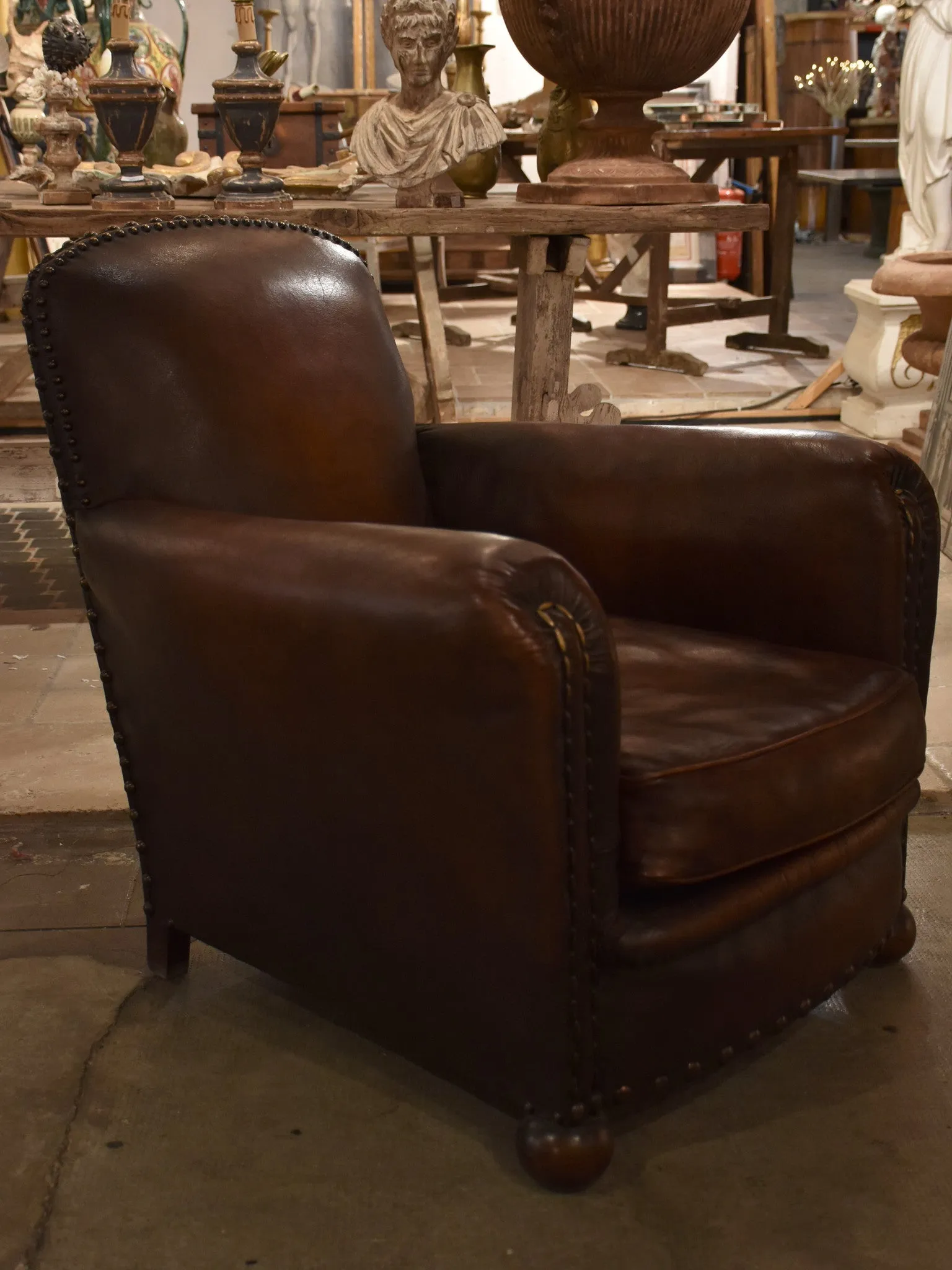 Dark French leather studded club chair - clouté