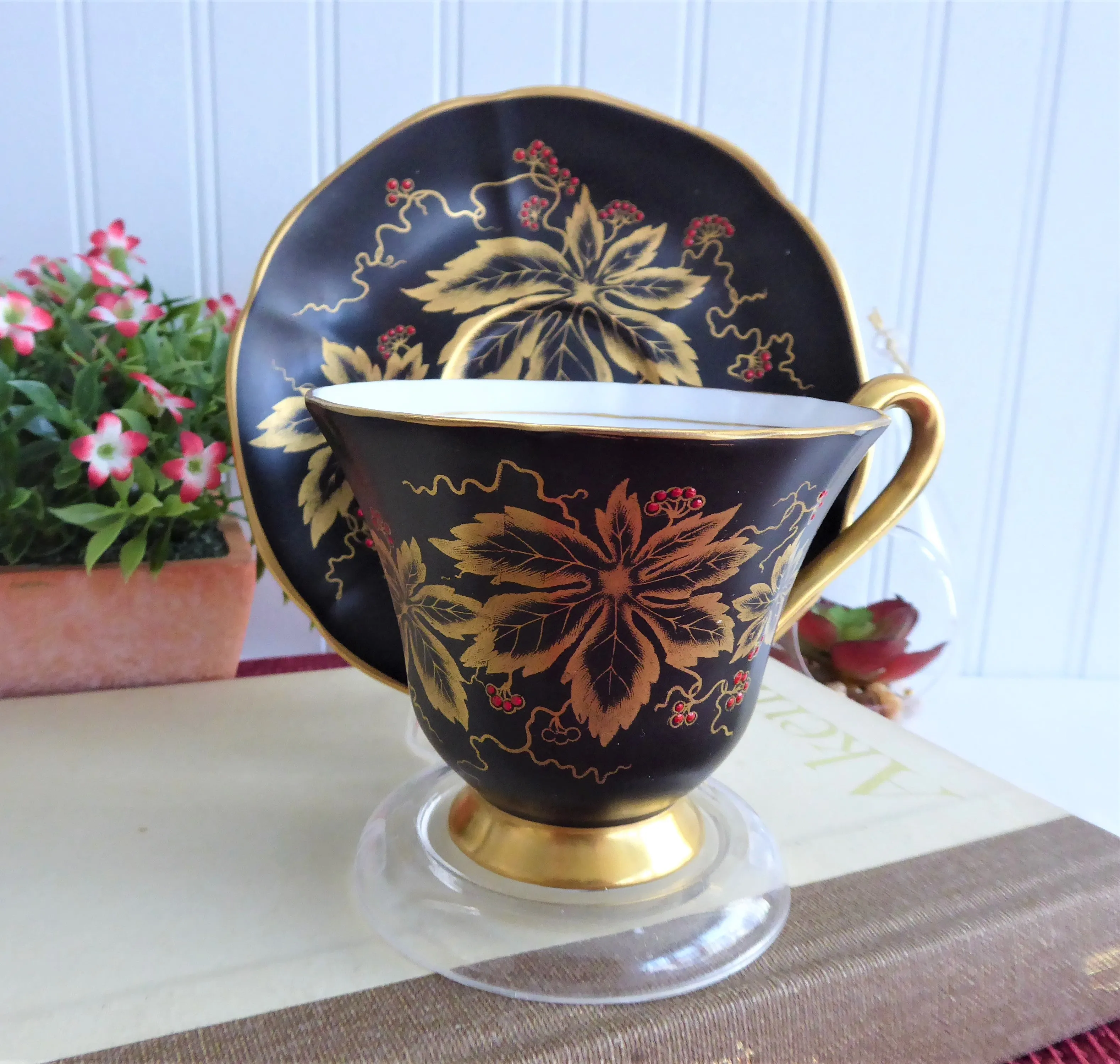 Elegant Black Cup And Saucer Metallic Gold Leaves Red Enamel Tuscan 1940s