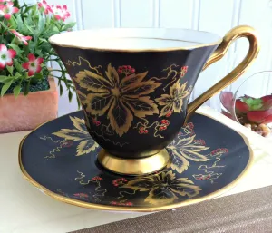 Elegant Black Cup And Saucer Metallic Gold Leaves Red Enamel Tuscan 1940s