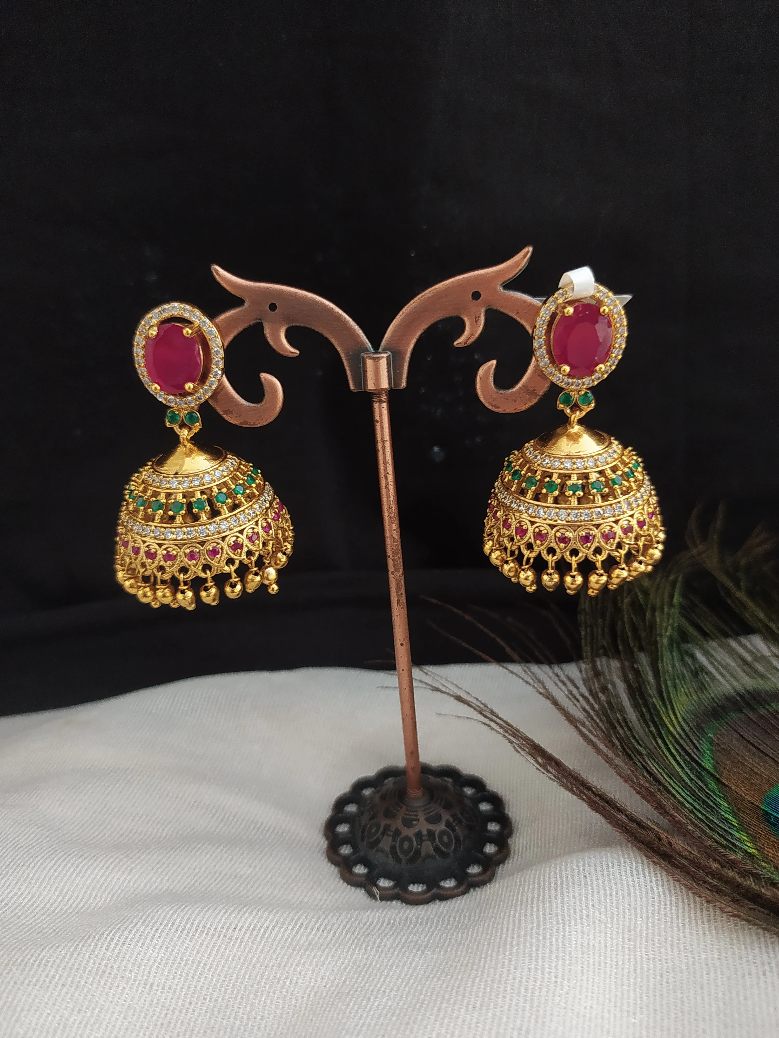 Elegant Gold-Plated Oval Shape Jhumki With Golden Balls