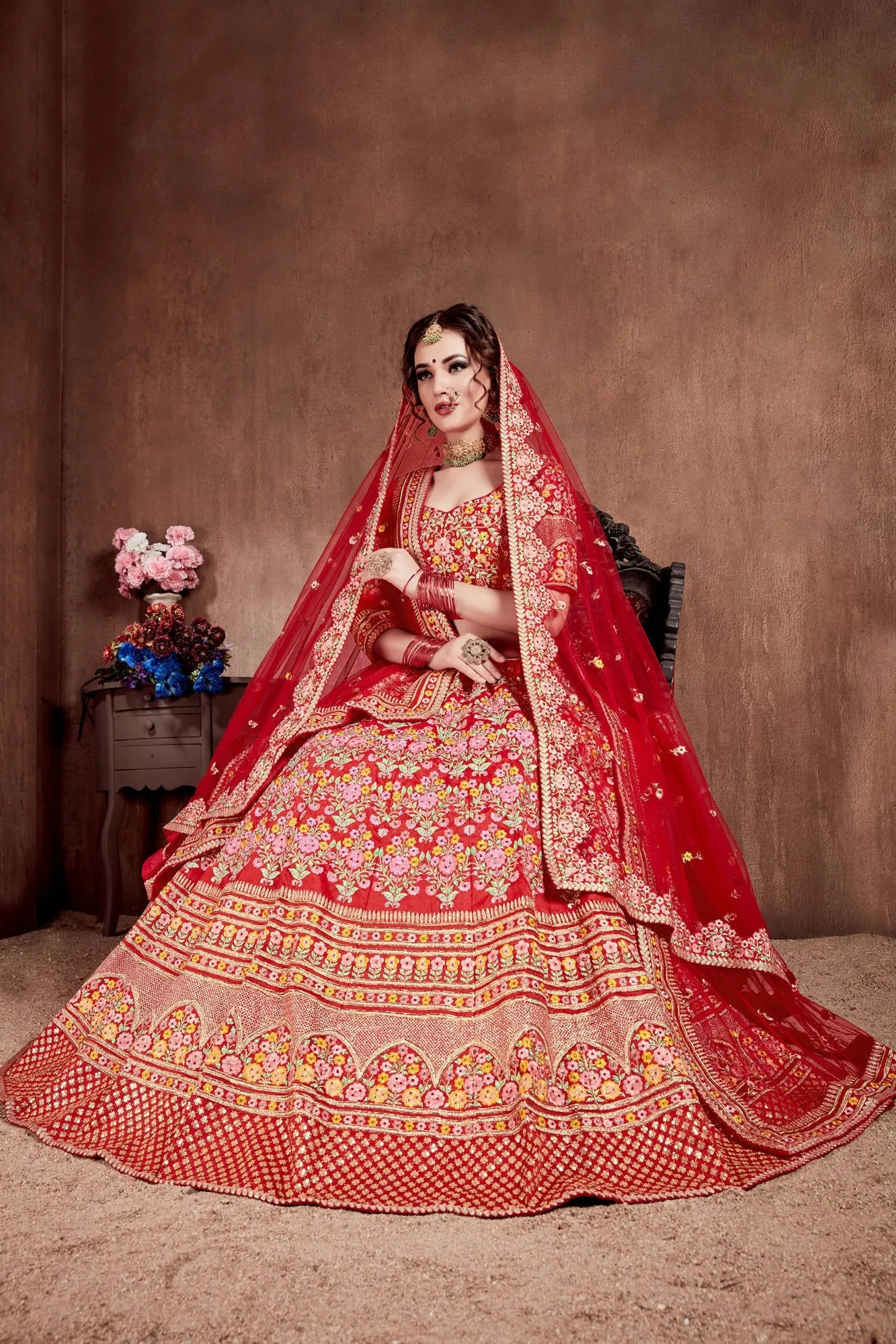 Flattering Red Colored Designer Bridal wear Embroidered Lehenga Choli