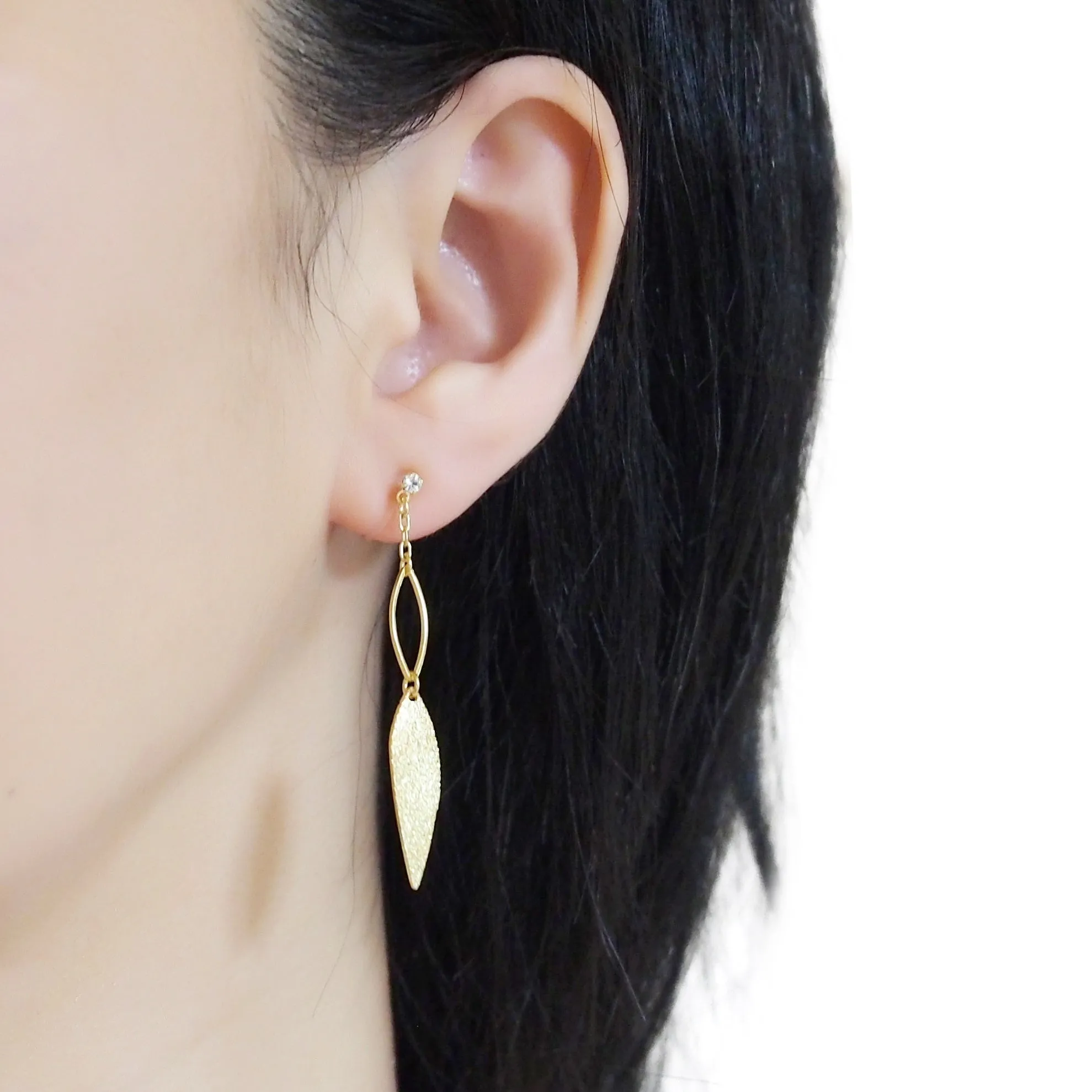 Gold textured metallic leaf invisible clip on earrings