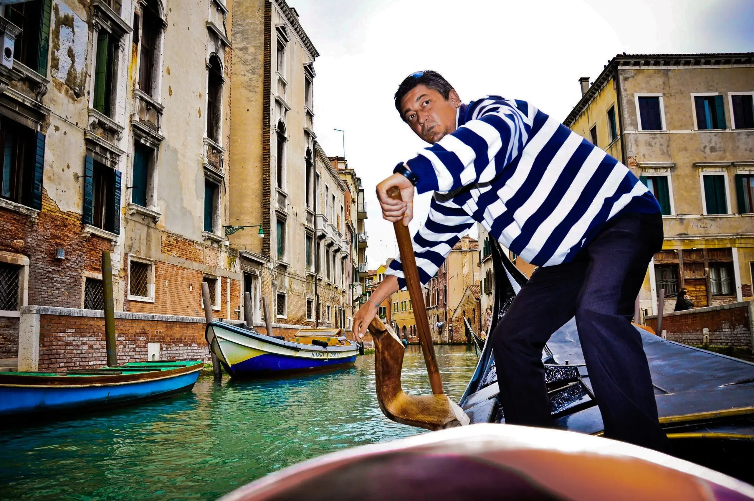 Gondoliers' Grace: Timeless Elegance on Venetian Waters