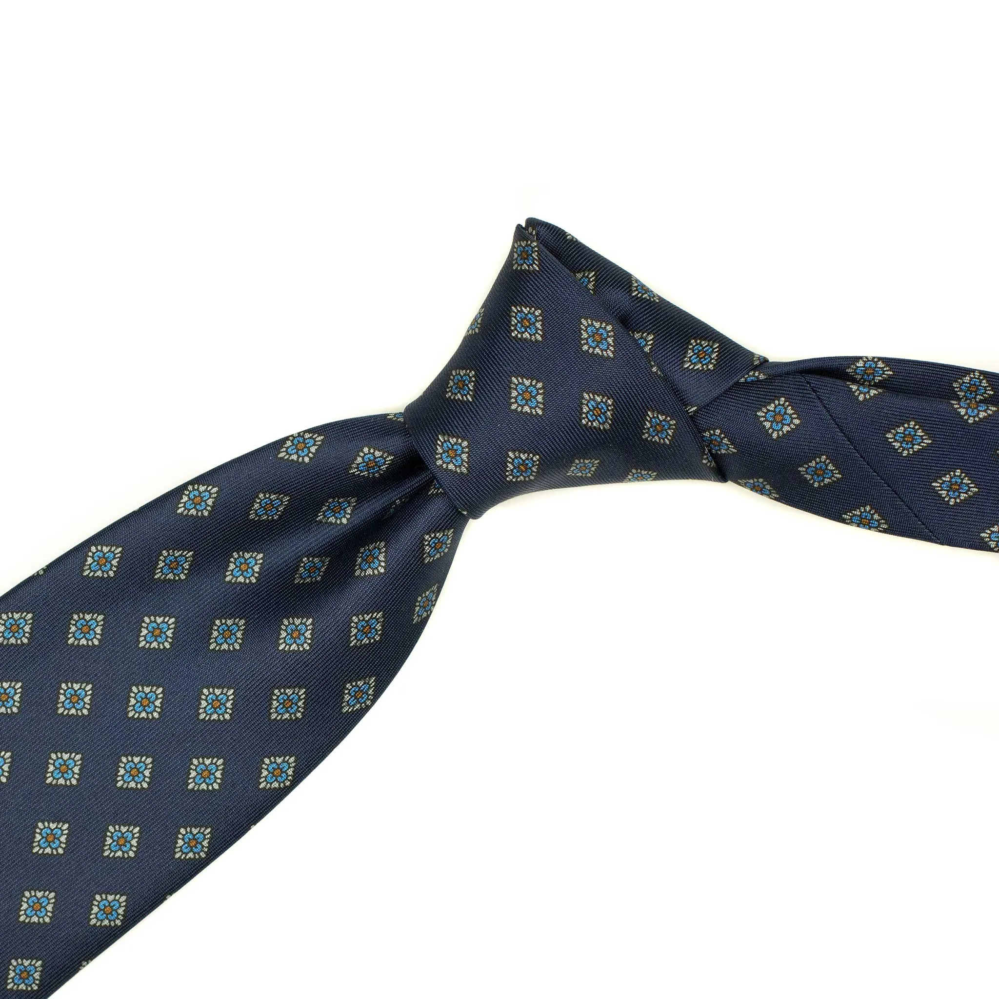 Hand-printed navy silk twill tie, blue and orange medallion print