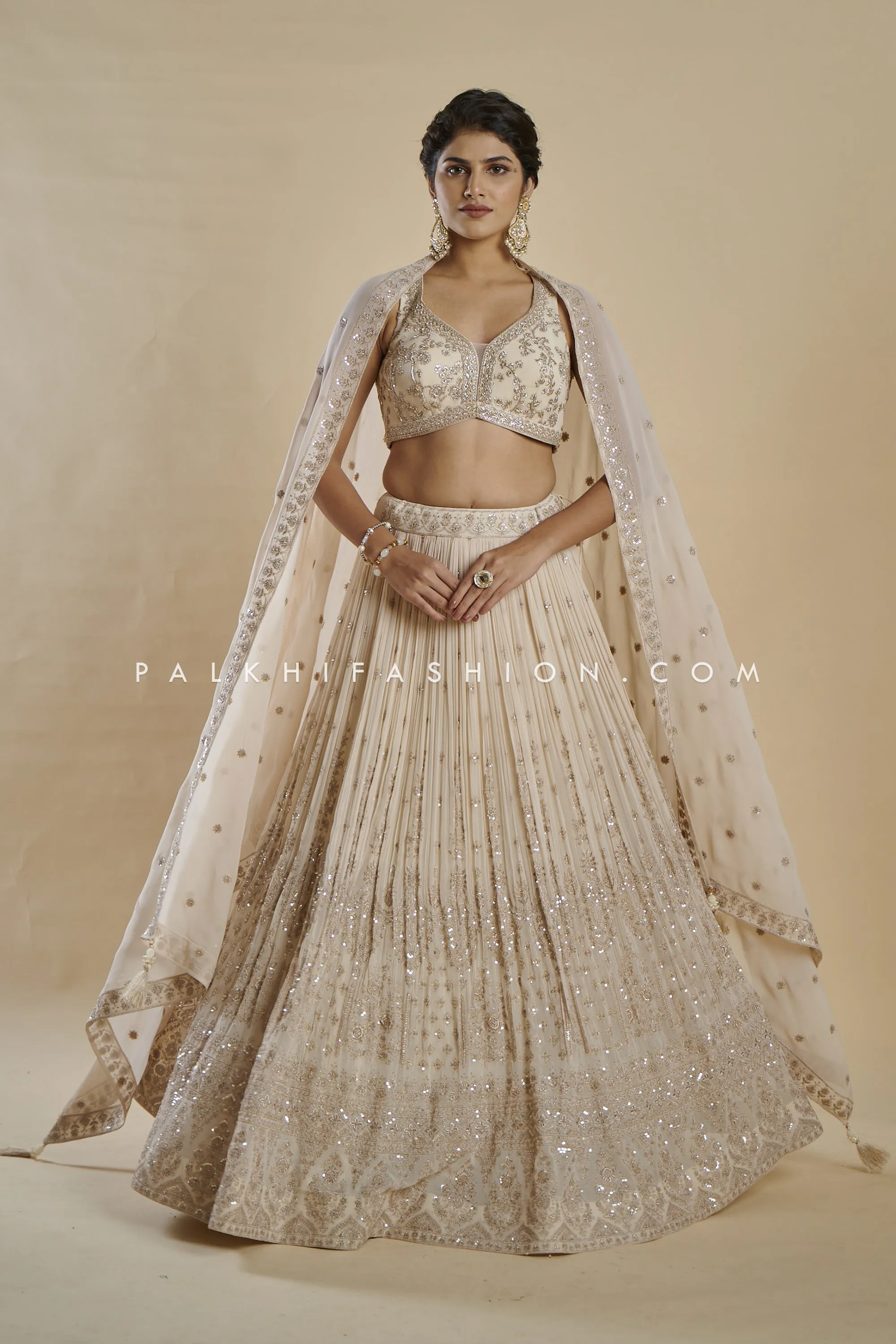 Imperial Charm: Exclusive Champagne Lehenga Choli with Handwork