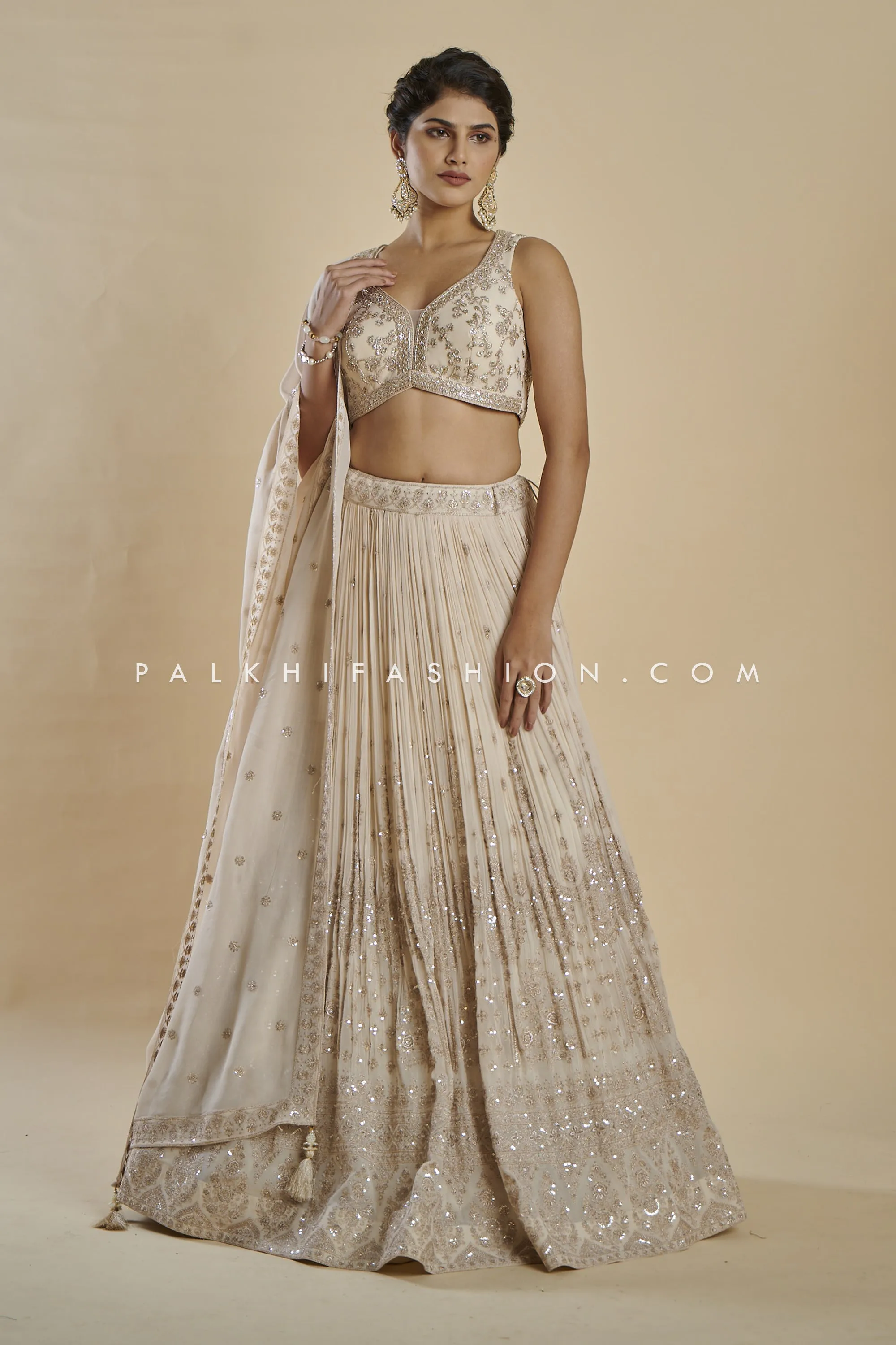 Imperial Charm: Exclusive Champagne Lehenga Choli with Handwork