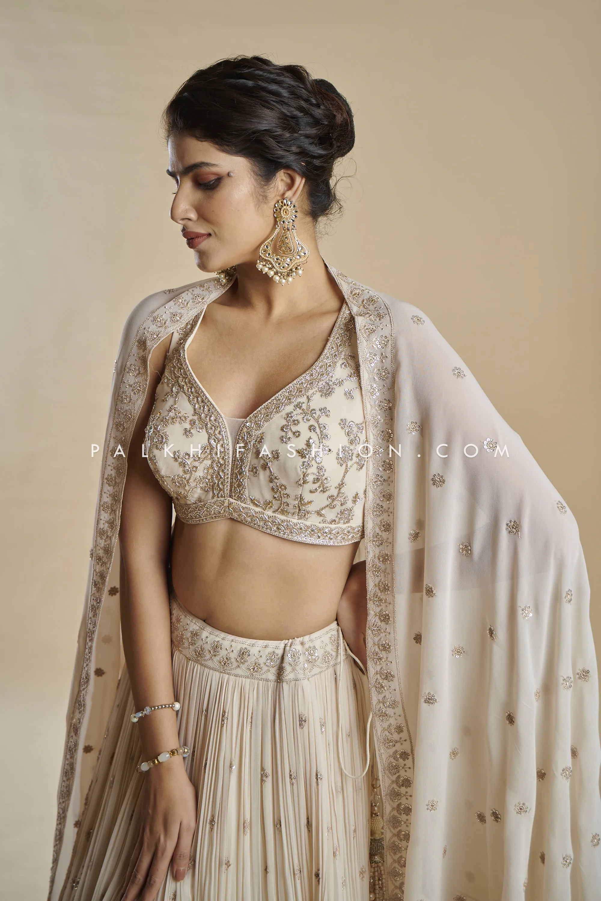 Imperial Charm: Exclusive Champagne Lehenga Choli with Handwork