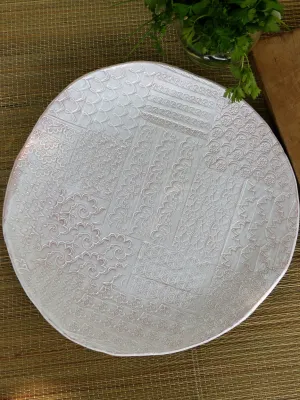 Large round platter with patchwork patterns