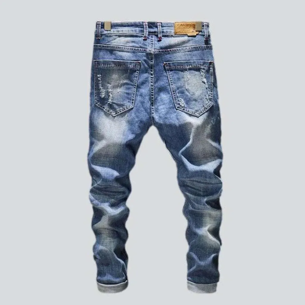 Light wash men's ripped jeans