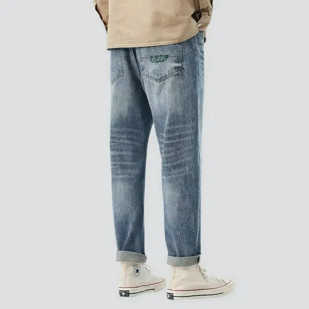 Medium-wash men's fashion jeans