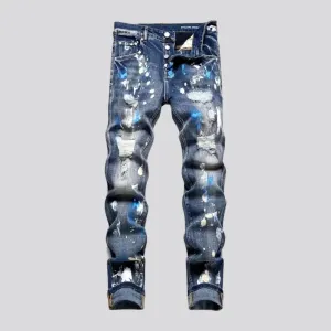 Medium-wash men's painted jeans