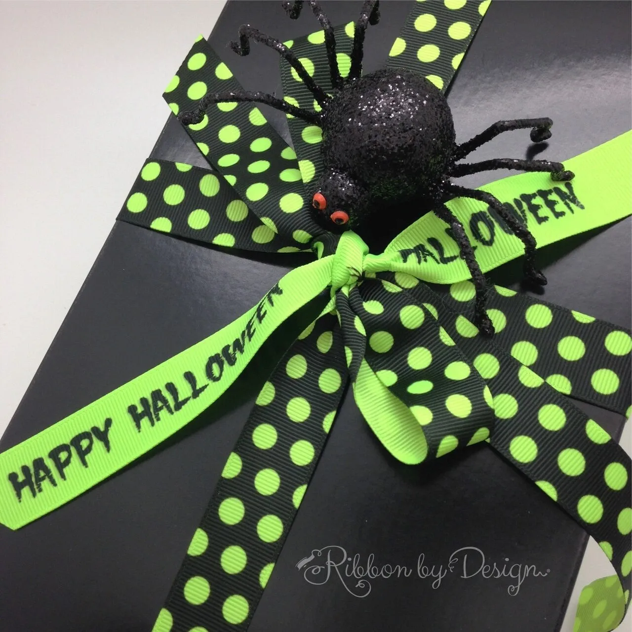 Neon green polka dots ribbon with a black background printed on 7/8" neon green grosgrain ribbon