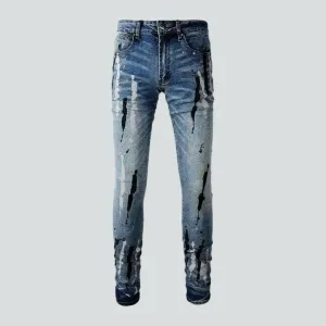 Painted men's light-wash jeans