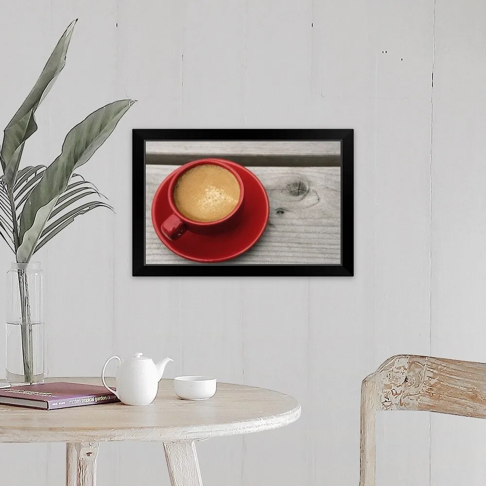 "A bright red cup of espresso coffee on a picnic table outdoors on a summer day." Black Framed Print