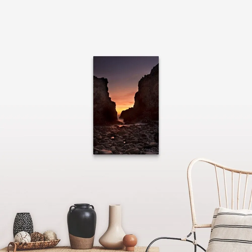 "A crescent moon sets through a dusk-colored sky at Pfeiffer Beach, CA, USA" Canvas Wall Art