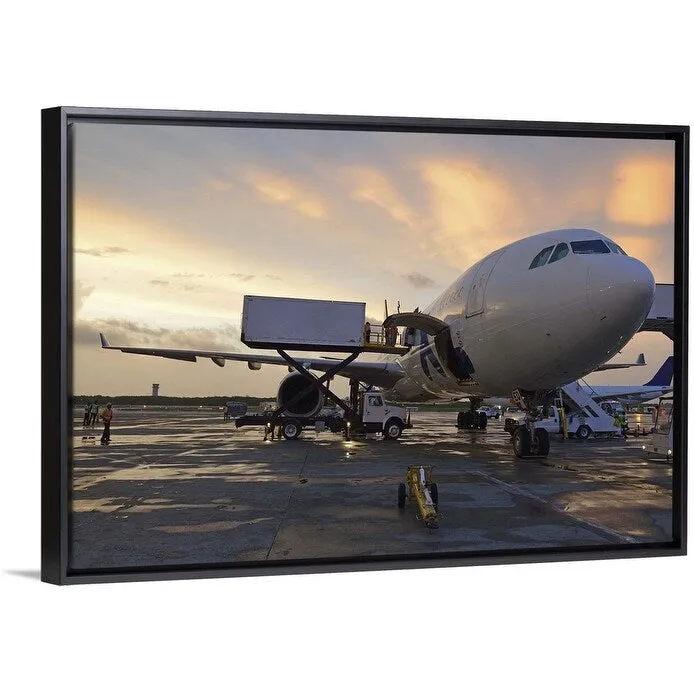 "Airplane on tarmac at sunset" Black Float Frame Canvas Art