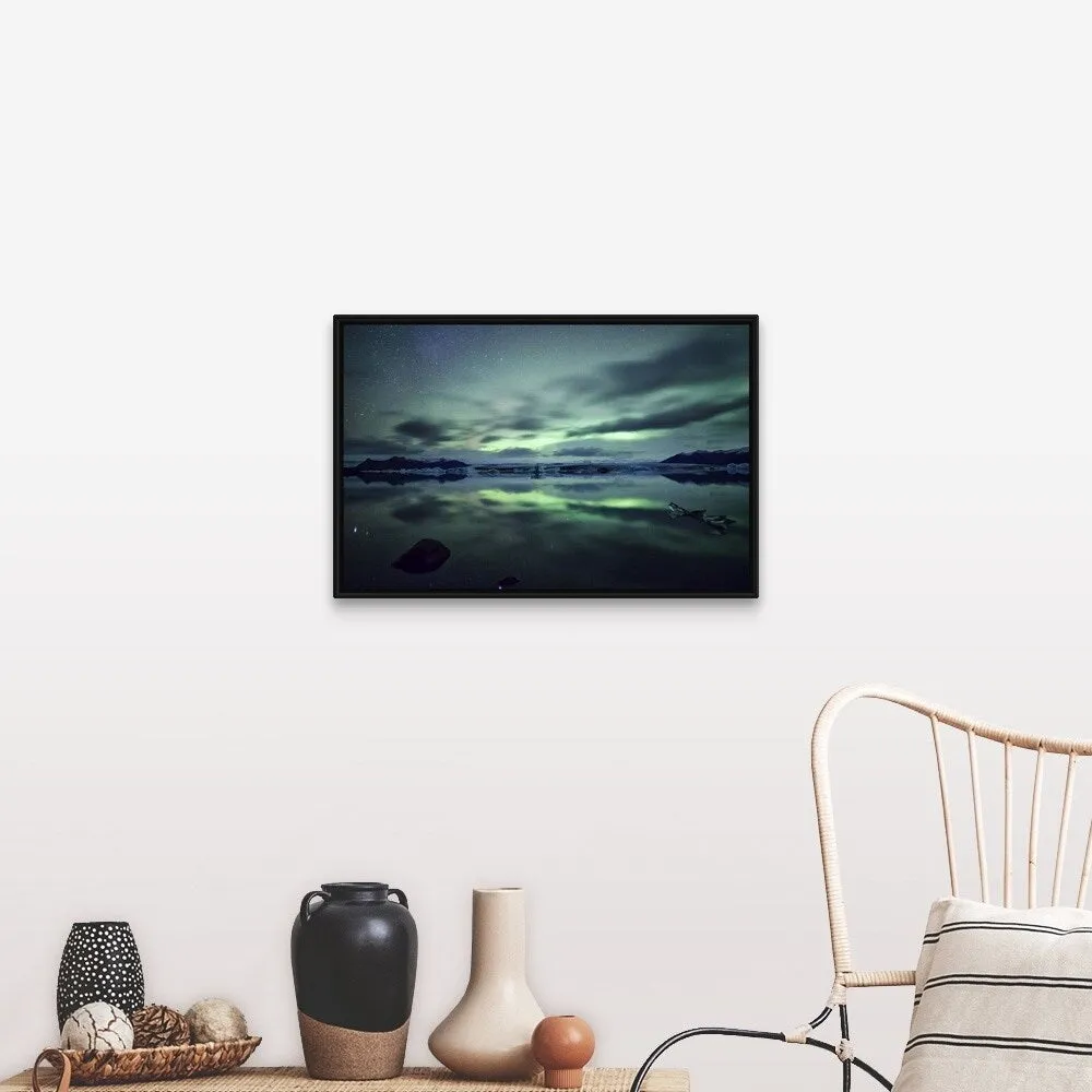 "Aurora borealis over Jokulsarlon glacial lagoon in south Iceland." Black Float Frame Canvas Art