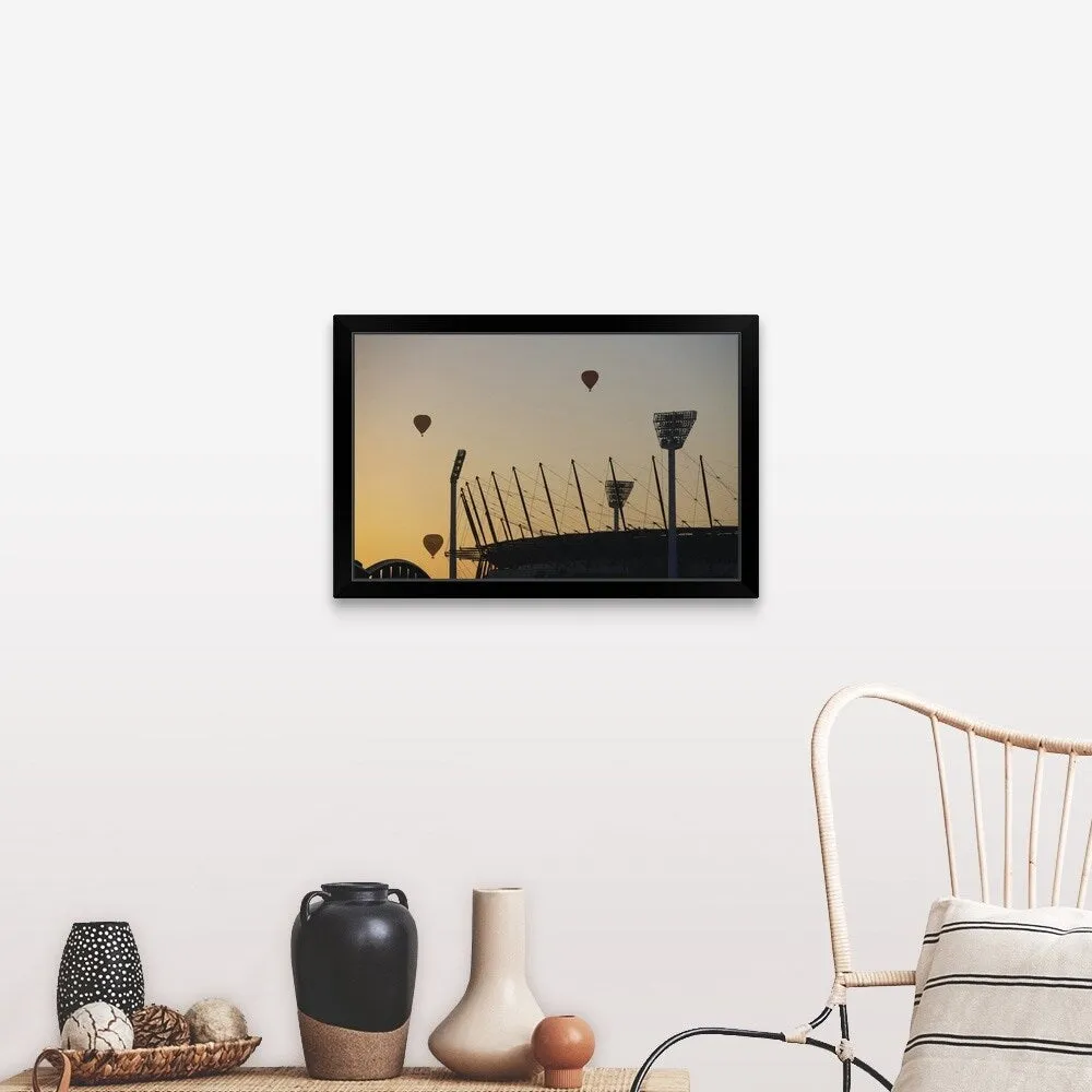 "Australia, Victoria, Melbourne, hot air balloons above cricket ground" Black Framed Print