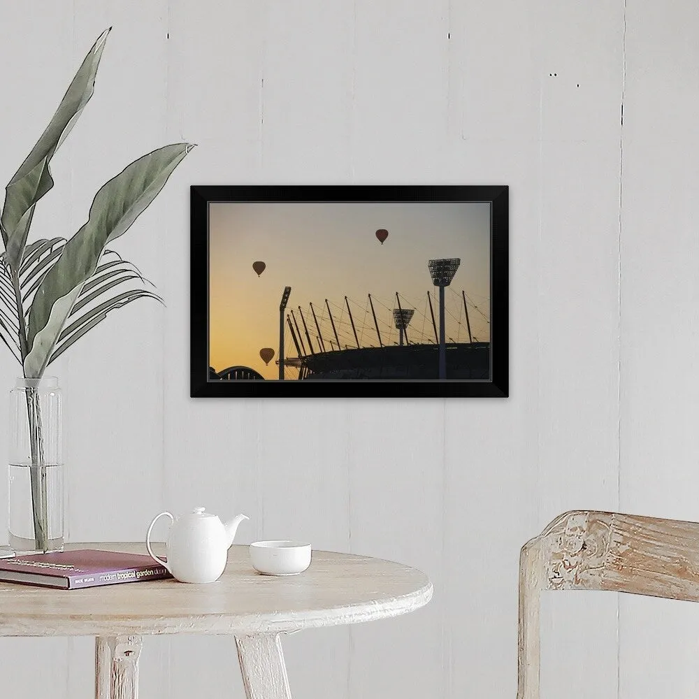 "Australia, Victoria, Melbourne, hot air balloons above cricket ground" Black Framed Print