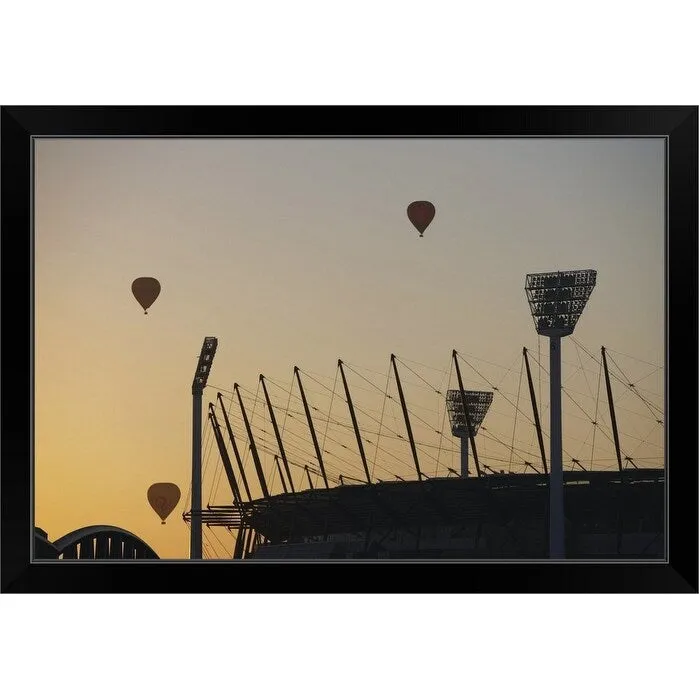 "Australia, Victoria, Melbourne, hot air balloons above cricket ground" Black Framed Print