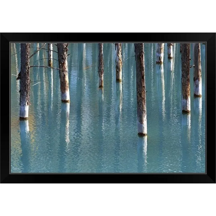 "Autumn tree in blue pond." Black Framed Print