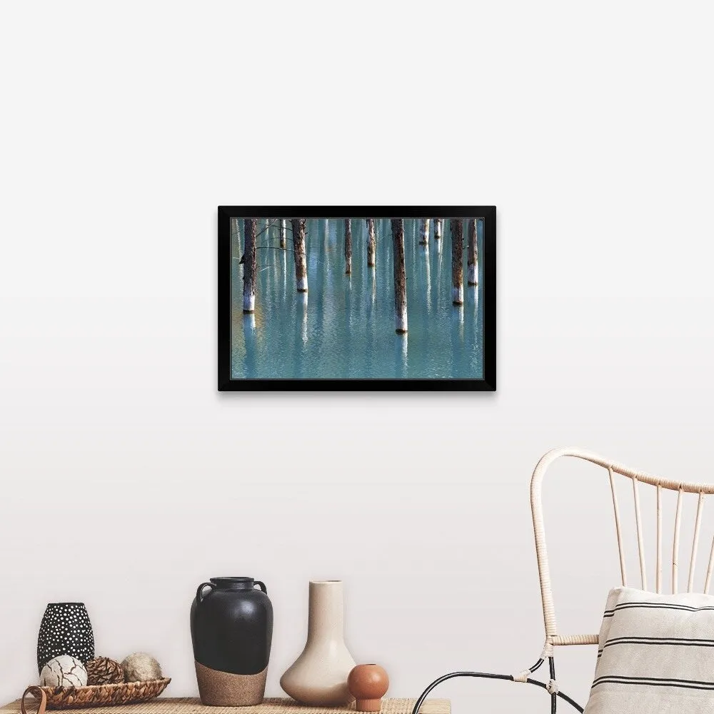 "Autumn tree in blue pond." Black Framed Print