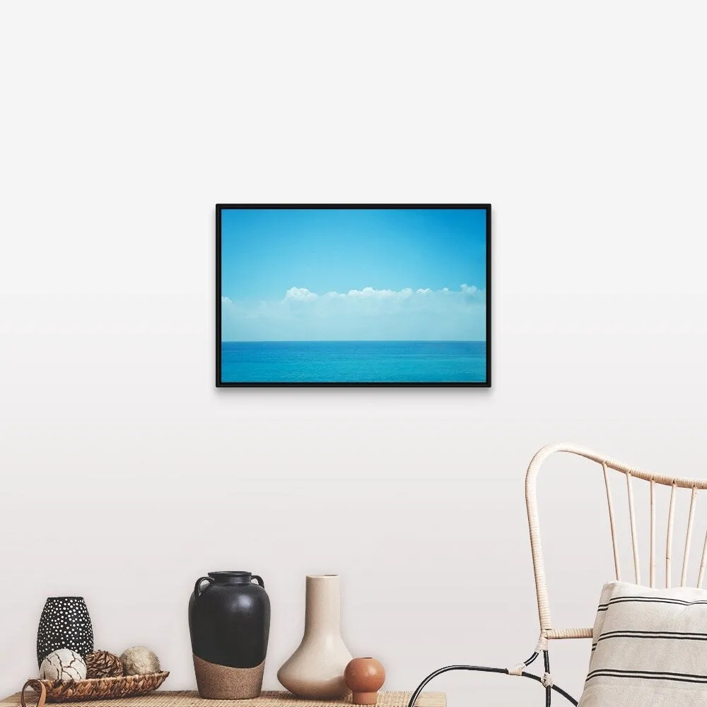 "Blue ocean with sky and clouds." Black Float Frame Canvas Art