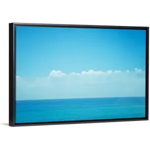 "Blue ocean with sky and clouds." Black Float Frame Canvas Art