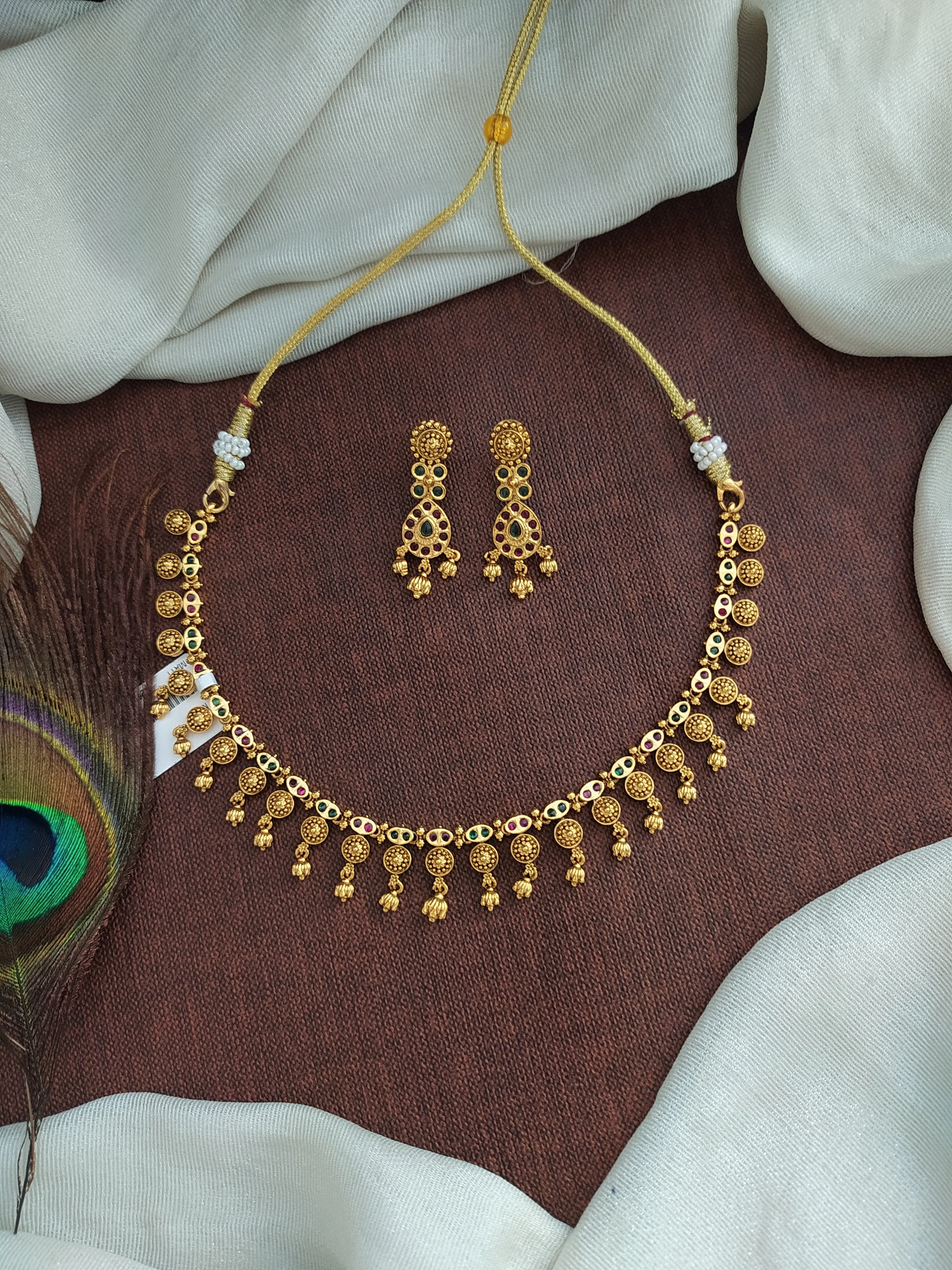 "Simple Antique Necklace Set with Kemp & Green Stones and Golden Ball Drops"