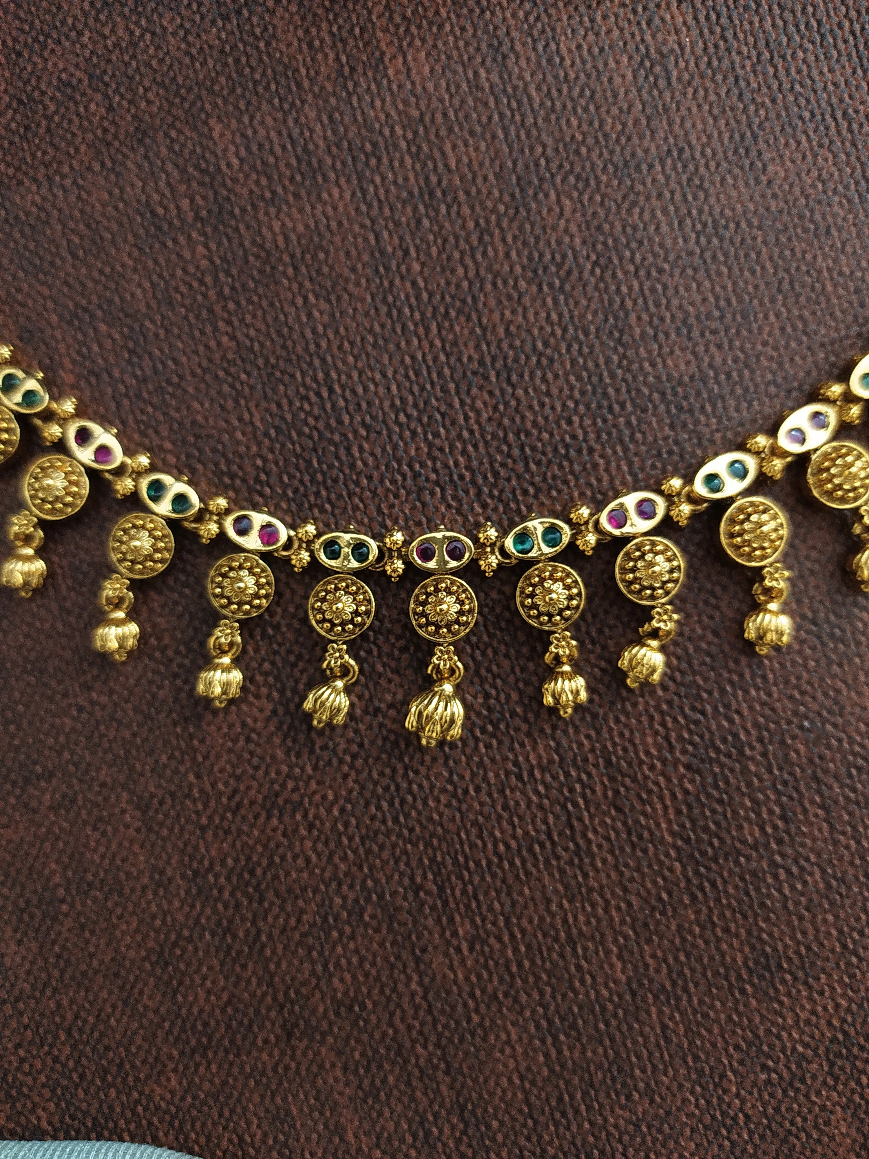 "Simple Antique Necklace Set with Kemp & Green Stones and Golden Ball Drops"