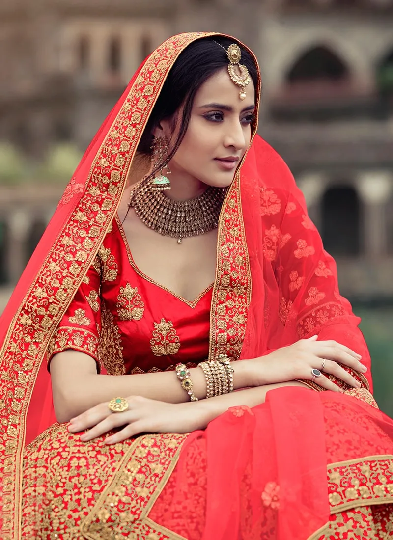 Red Color Zari And Stone Work Satin Material Bridal Lehenga