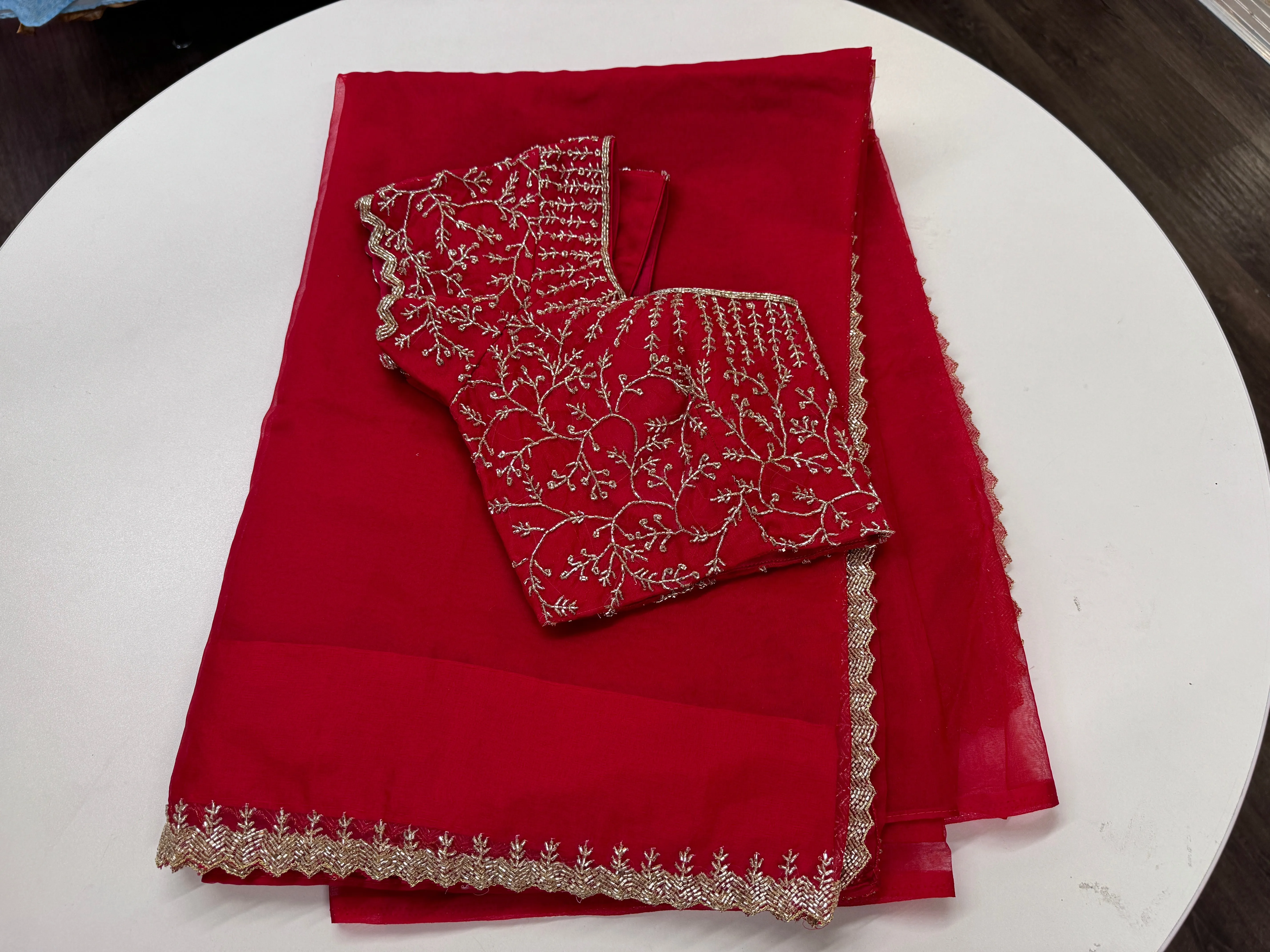 Rose red embroidered Organza saree with stitched blouse