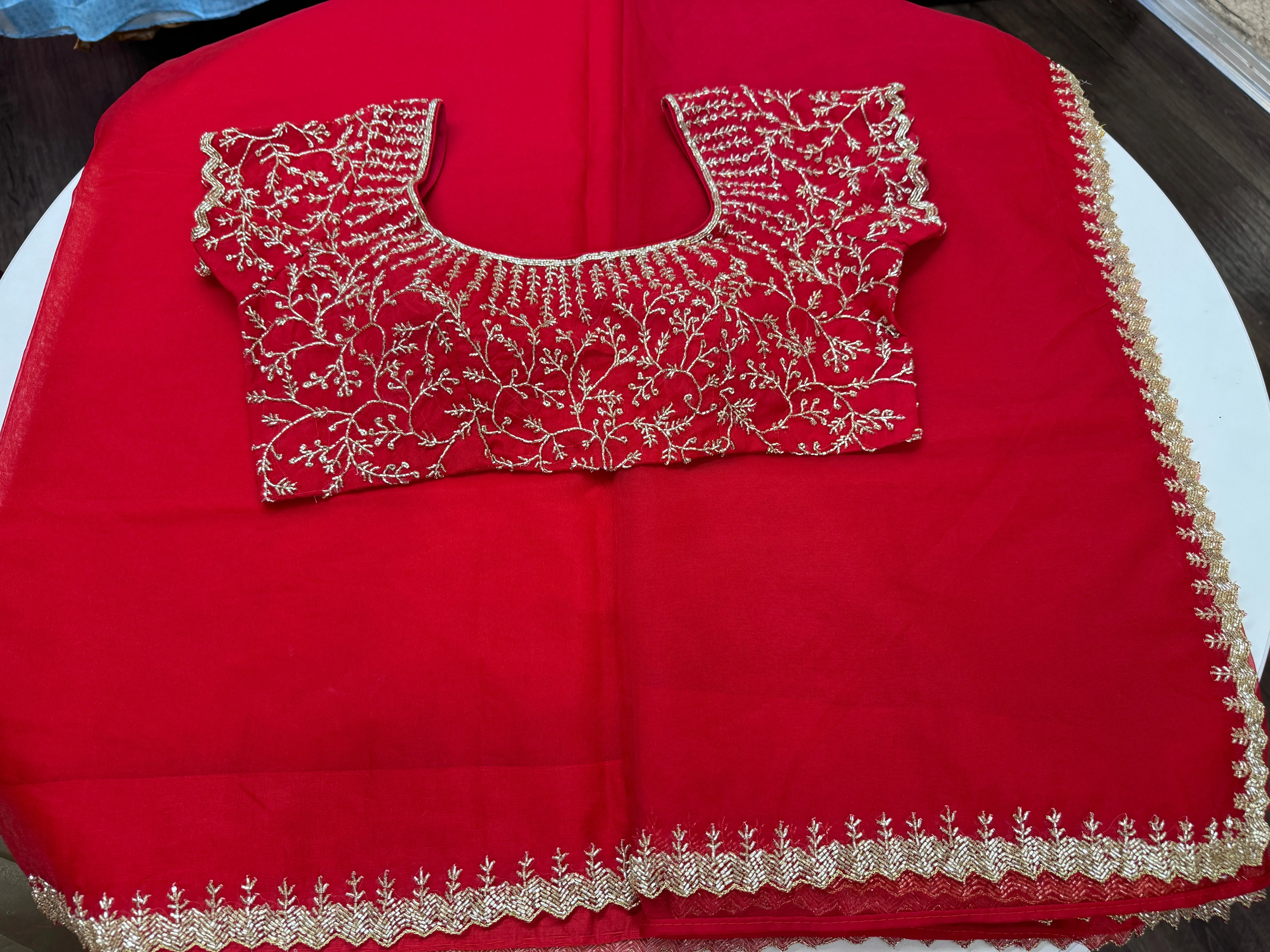 Rose red embroidered Organza saree with stitched blouse