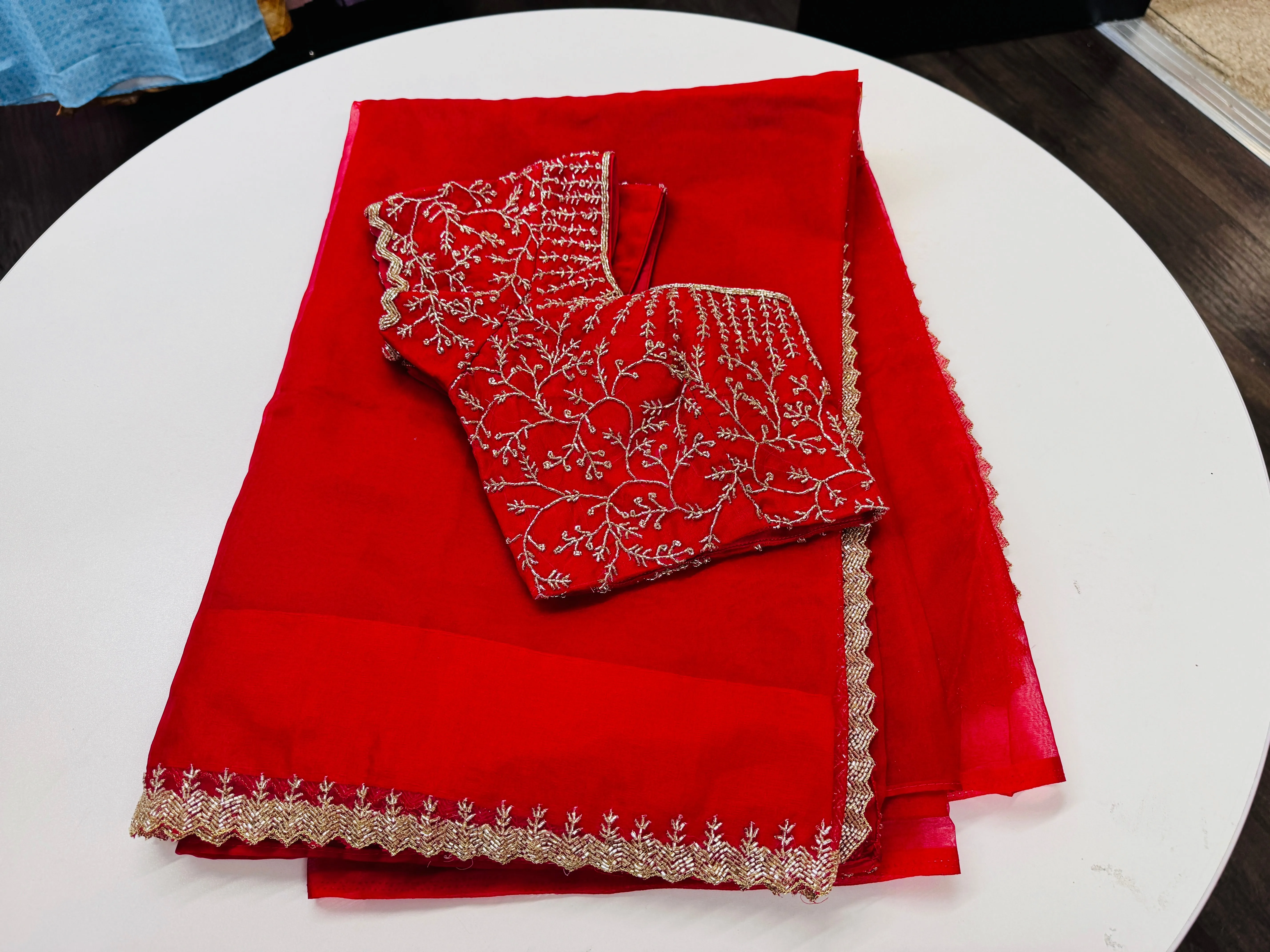 Rose red embroidered Organza saree with stitched blouse