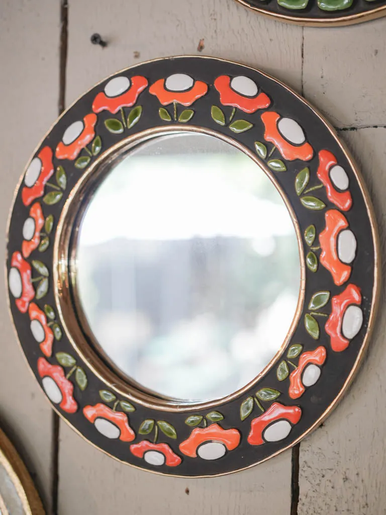 Round mid-century mirror w/ retro orange flowers Mithe Espelt (1924-2021) - 10¾"